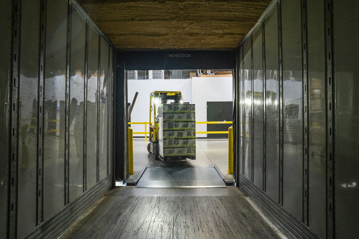 Forklift moving pallets in a warehouse