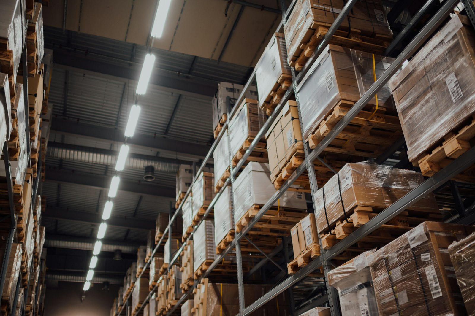 Cardboard boxes stacked on a warehouse rack